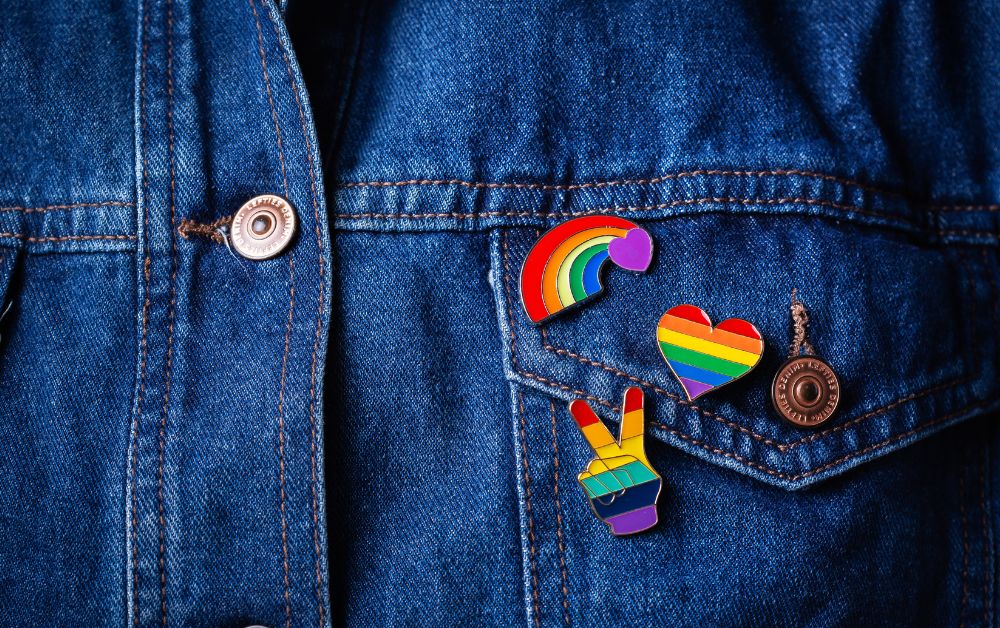 An image of various enamel pins for an article about how to make enamel pins.