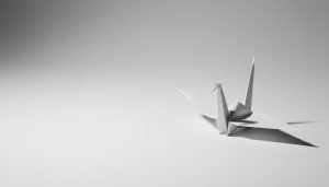 Minimalist editorial product shot (white crane on light-gray background)