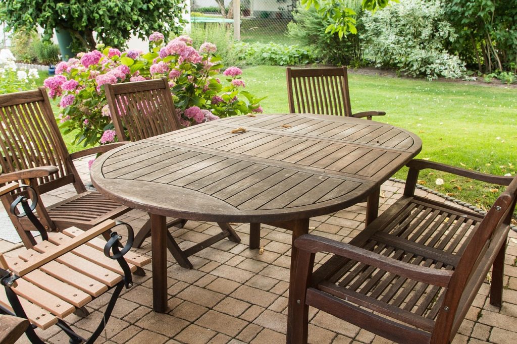 A photo of outdoor furniture in need or cleaning and restoration.