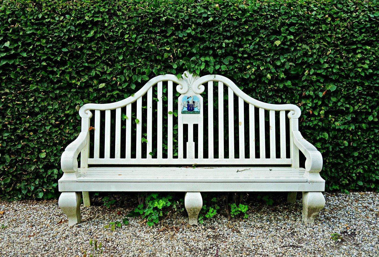 a photo of a well maintained outdoor timber bench seat.