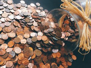 an image of pennies poured out from a jar.
