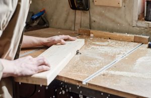 An image of a person using a benchtop CNC router.