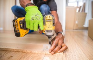 An image of a person using a cordless drill.