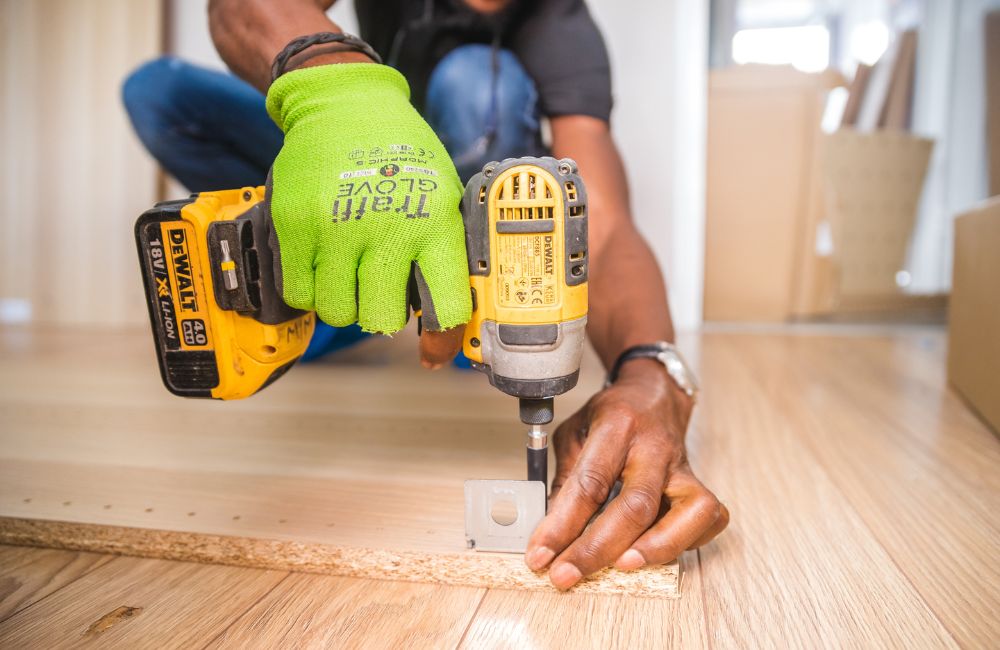 An image of a person using a cordless drill.