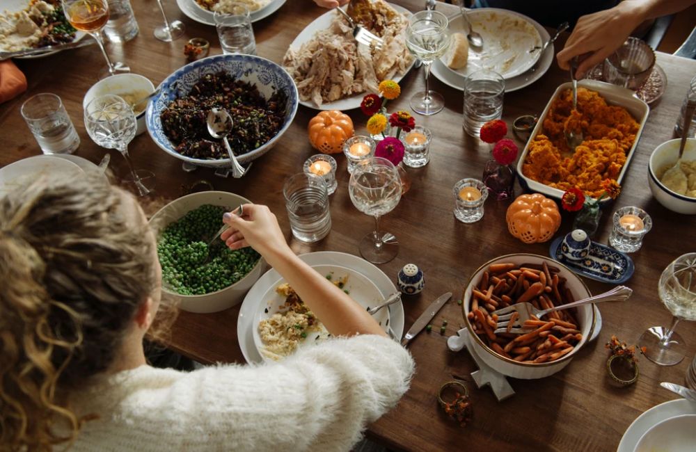 An image of a family enjoying Thanksgiving food during the holidays.