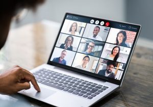 An image of an employee conducting a business video conference.