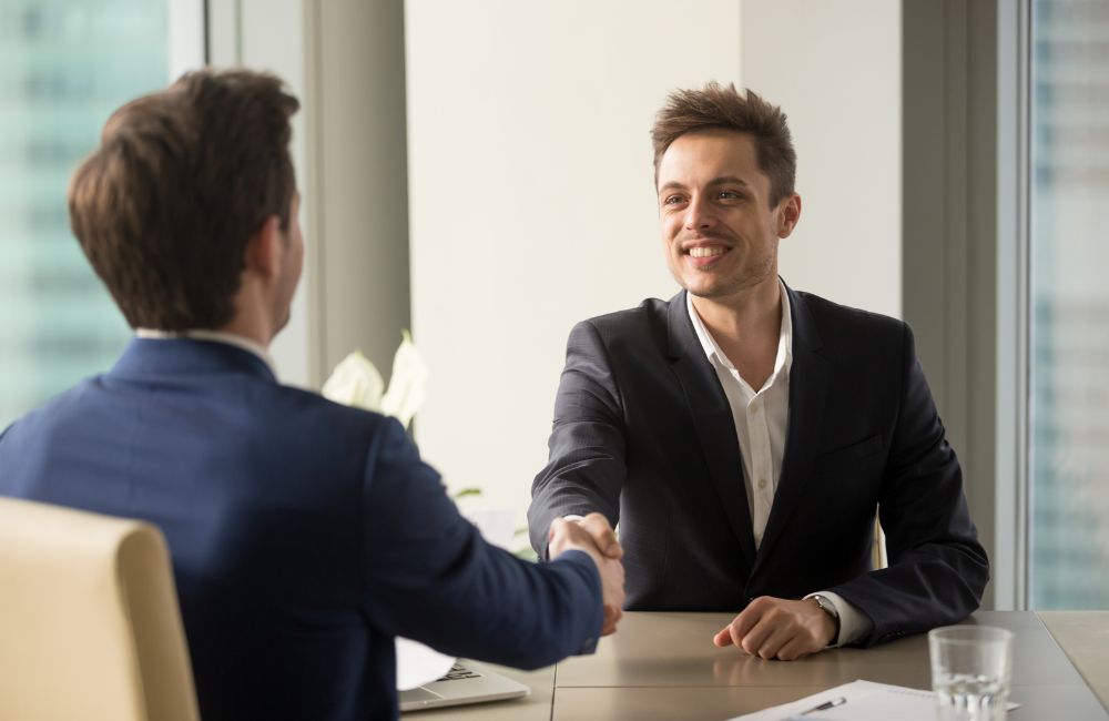 An image of applicant during an interview for an article about being asked "why do you want to work here?"