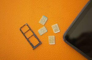 An image of four different SIM cards for an article about eSIM vs Physical SIM cards.