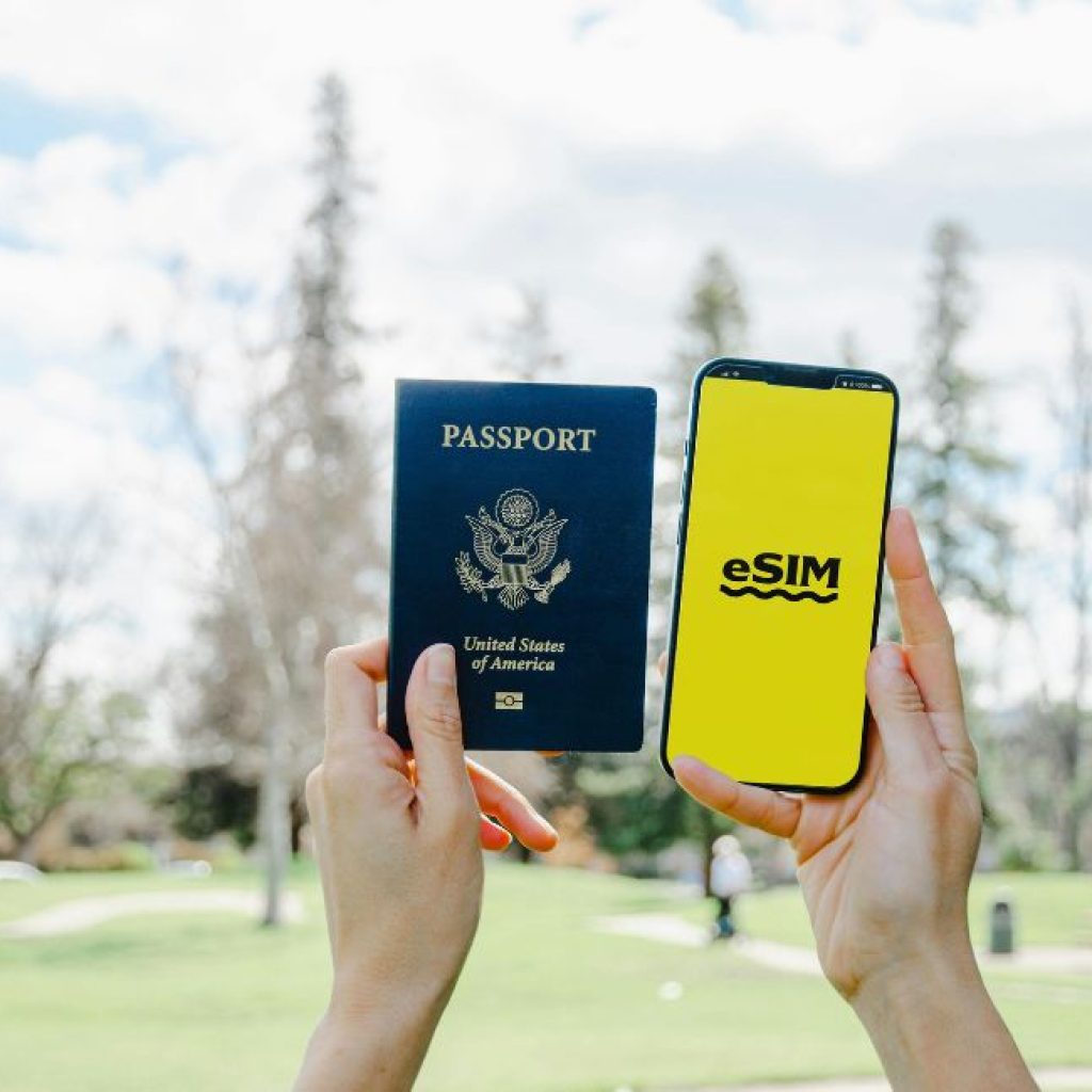 An image of a passport and a mobile phone with an eSIM.