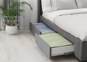 Some beds with storage have concealed compartments that are integrated into the headboard, footboard, or side rails.