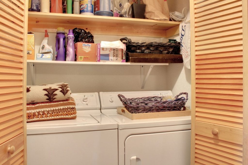 An image of a laundry room for an article about "Laundry Room Shelves Ideas."