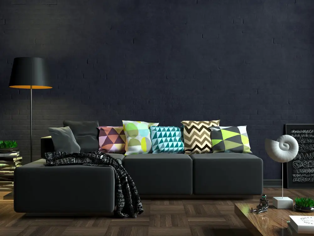An image of a living room with black tones.