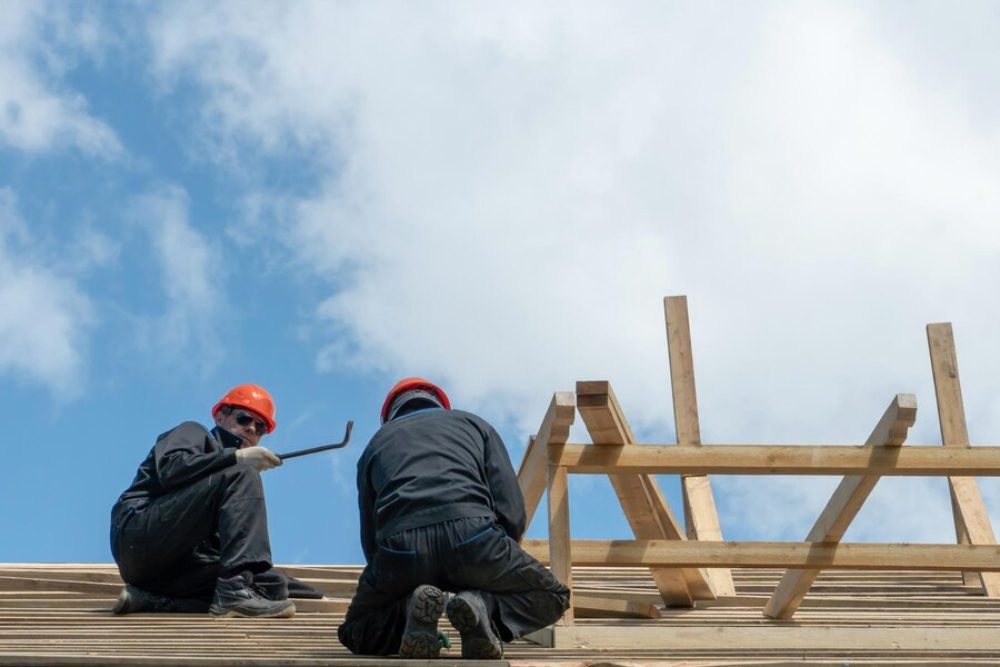 An image of two roofing contractors