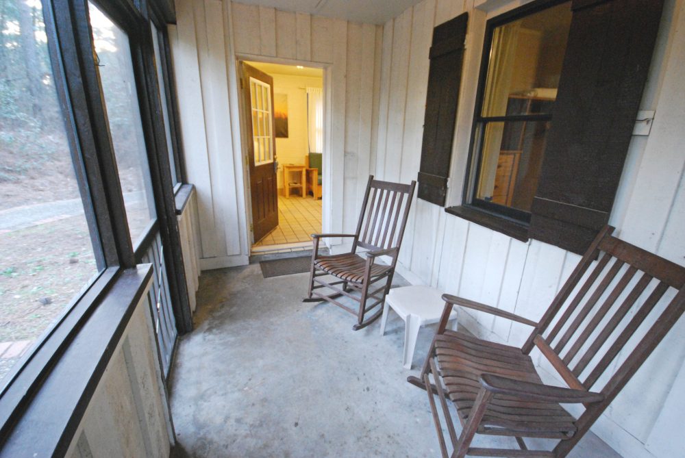 An enclosed patio with glass windows.