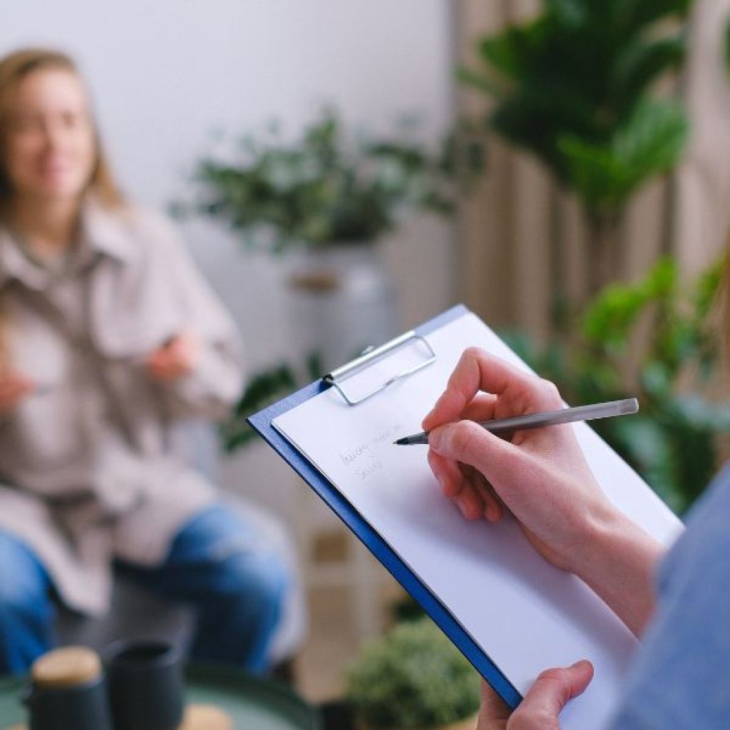 A therapist providing consultation to a Gen Z woman. 