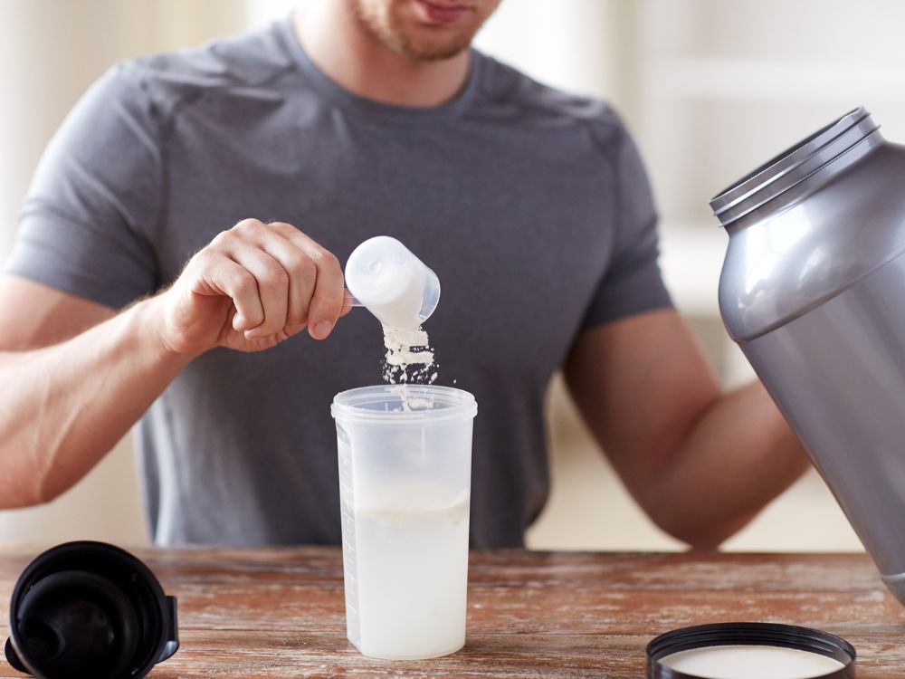 an image of a man making a protein shake.
