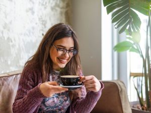 An image of a woman drinking coffee.