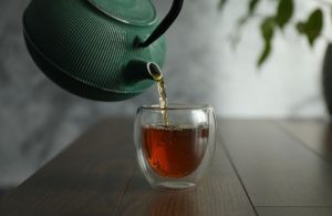 An image of tea being poured for an article about how to brew tea.