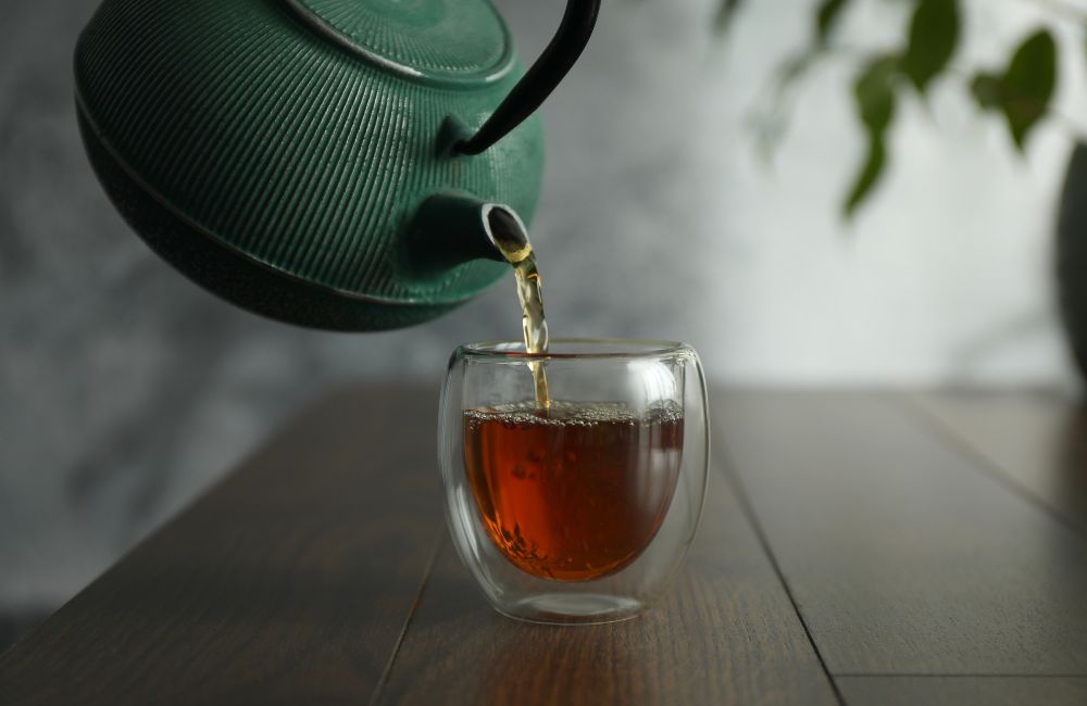 An image of tea being poured for an article about how to brew tea.